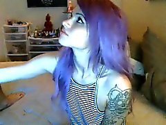 Tattooed guy is jerked off by sexy purple haired girlfriend