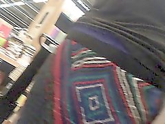 Hidden camera upskirt video of a woman walking in the books