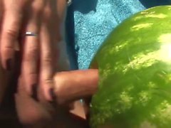 Shemale fucks a watermelon