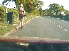 Amateur crossdresser in lingerie on a road